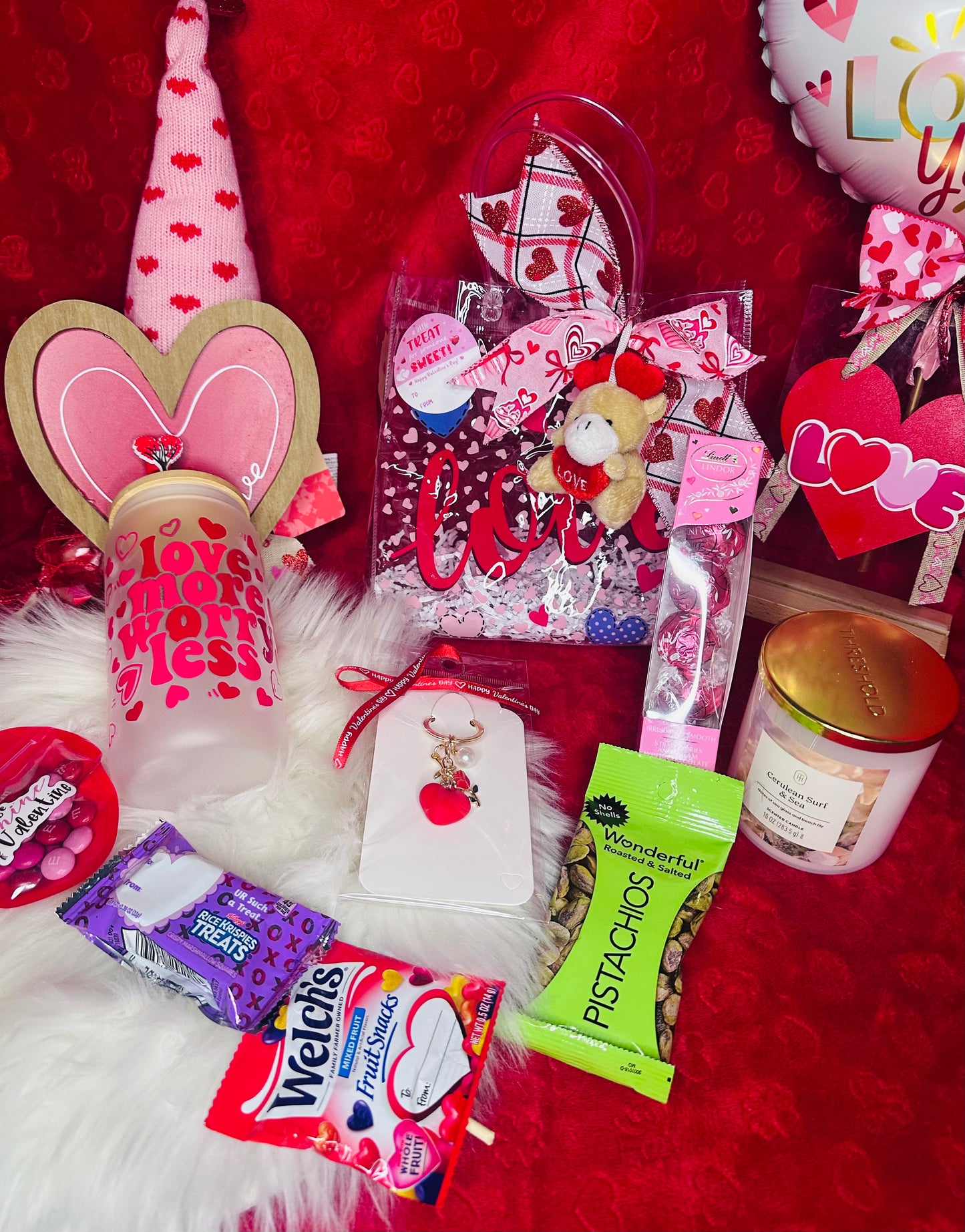 Curated Valentine’s Day gift set with aesthetic glassware, scented candle, gourmet chocolates, and heart-themed accessories