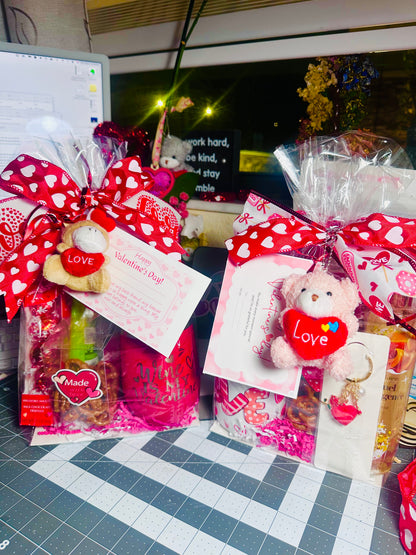 Valentine's Day gift bundle for her featuring a Wine is My Valentine tumbler, plush bear, Lindt chocolate, and Bath and Body Works soap.
