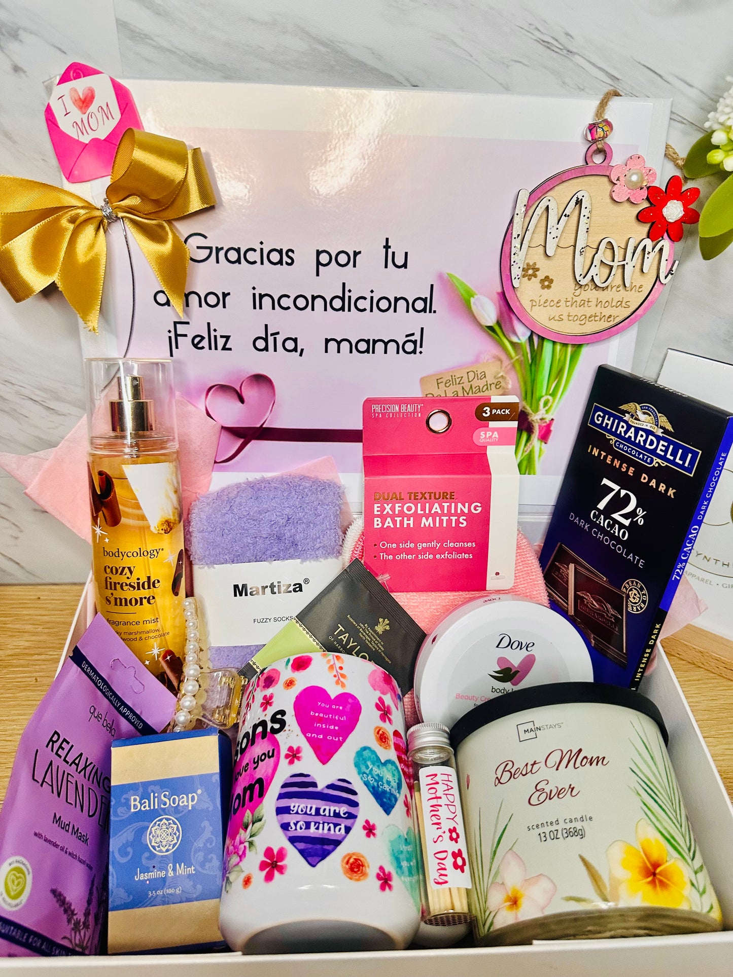 Wellness and self-care items including a lavender face mask, body cream, artisan soap, and a gold-trimmed candle jar.