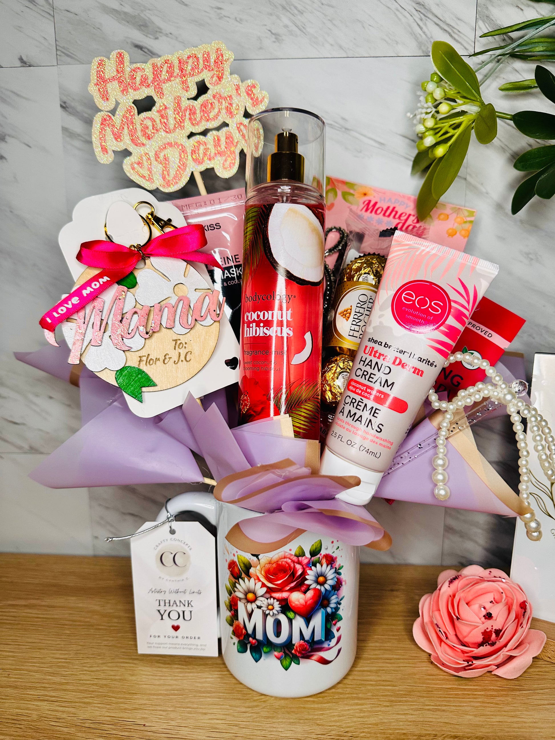 Mug bouquet gift set featuring a 15 oz ceramic mug, coconut hibiscus body mist, and Ferrero Rocher chocolates.