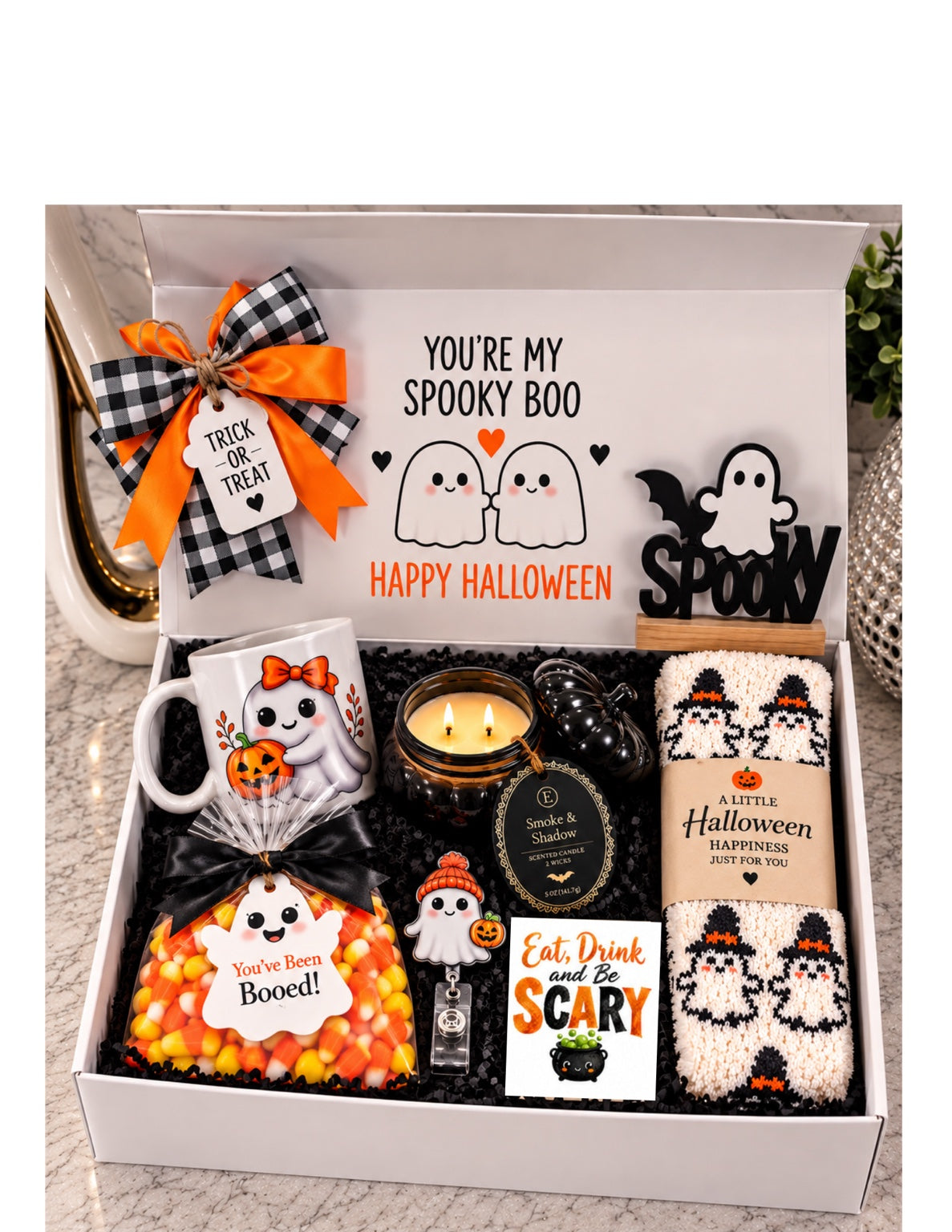 Halloween Boo gift box with ghost mug, candle, fuzzy socks, candy corn treats and spooky accessories