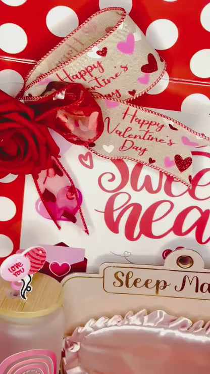 Short video showcase panning over the contents of the Valentine's Day spa gift box, highlighting the glittery details on the tumbler and the luxury rose-accented bow on the packaging