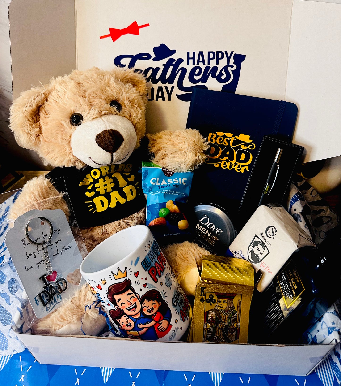 Ultimate Dad Father’s Day gift box with teddy bear in World’s #1 Dad tee, bilingual El Mejor Papá mug, journal, playing cards, and grooming gifts in a navy themed box